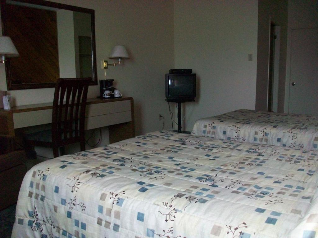 Motel Princesse Saguenay Quarto foto